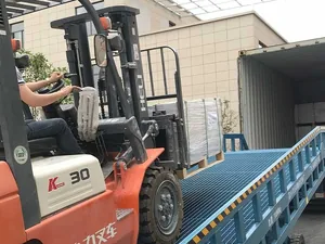 A container being loaded with palletised flooring
